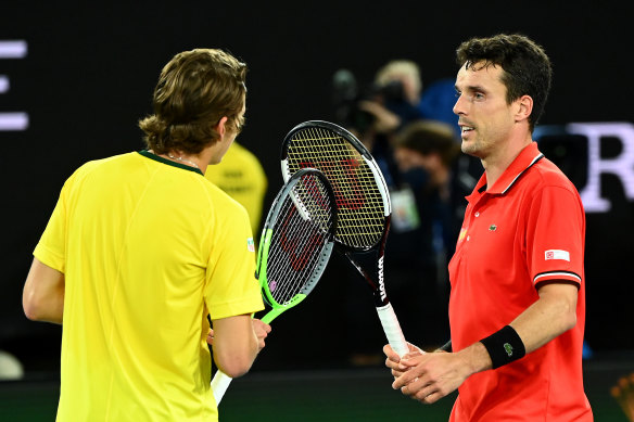 Australian Alex de Minaur and Spain’s Roberto Bautista Agut congratulate each other after their group B singles match on day one of the ATP Cup on Tuesday.