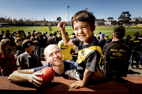 Ben Johnston and his son Gerard watched Richmond train on Thursday, in preparation for the Tigers' preliminary final clash against Geelong. 