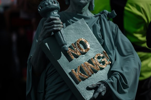 A protester dressed in a Statue of Liberty costume. 