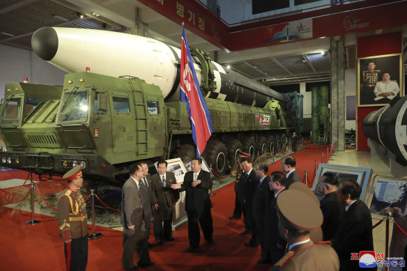 Kim Jong-un in front of what North Korea says is an intercontinental ballistic missile on display in Pyongyang.
