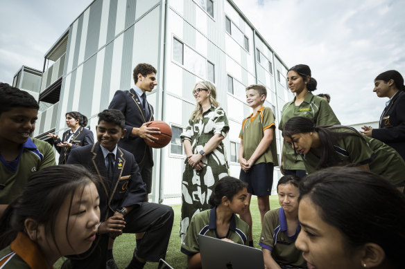 Acting principal of Alamanda College - Felicity Mayes - with year 6-9 student captains and house leaders. The school had grown to more than 3000 students since opening in 2013. 