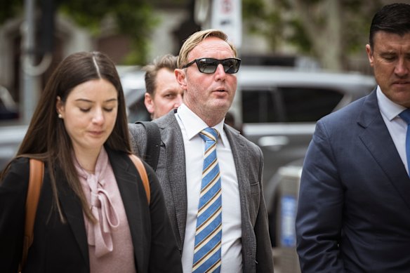 First Guardian co-founder David Anderson (in sunglasses) arrives at the Federal Court on Monday.
