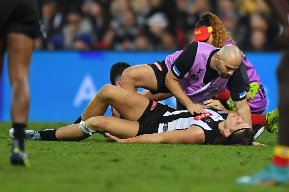 Darcy Moore was carried from the ground late in the last quarter on Saturday night.