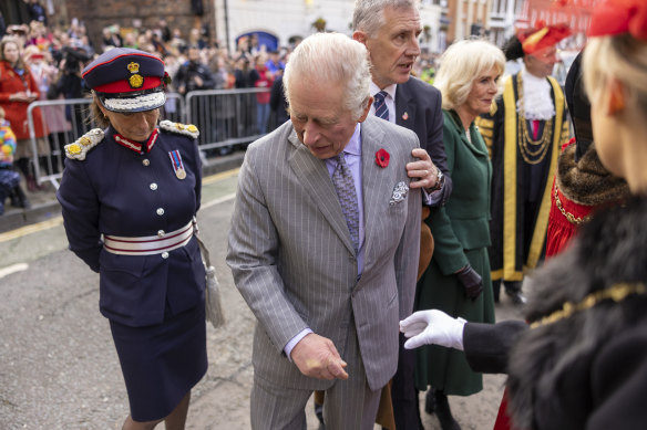 Britain’s King Charles III reacts after an egg was thrown in his direction.