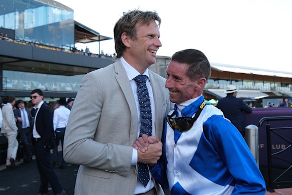 Trainer Bjorn Baker and jockey Nash Rawiller after Blue Door’s win.