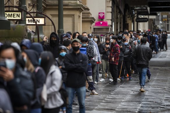 People waiting to get vaccinated against COVID-19 at Melbourne Town Hall this week.