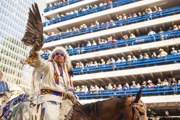 First Nations man leading a Calgary Stampede parade.