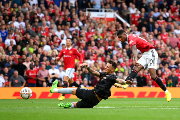 Marcus Rashford scores for Manchester United against Arsenal at Old Trafford.
