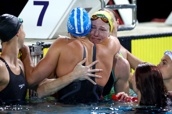 Cate Campbell is surrounded by her fellow competitors after swimming the final of the women’s 50m freestyle.