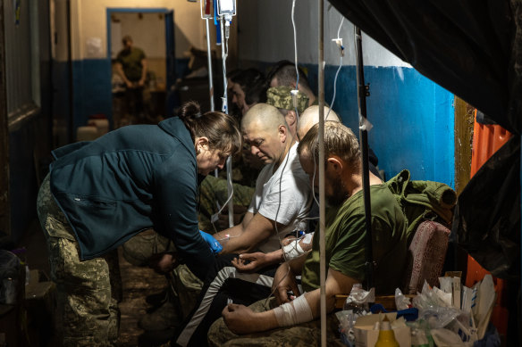 Members of the Ukrainian military receive treatment for concussions and light injuries from Ukrainian military medics at a frontline field hospital in Popasna, Ukraine.