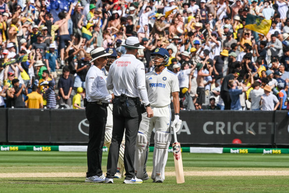 Jaiswal questions the on-field umpires after being given out.