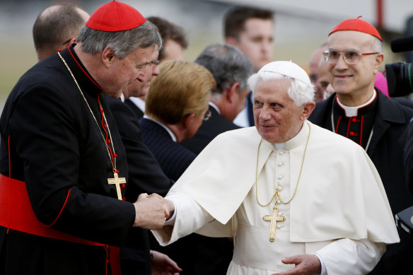 Pope Benedict XVI is greeted by Cardinal George Pell upon the pontiff’s arrival in Australia in 2008.