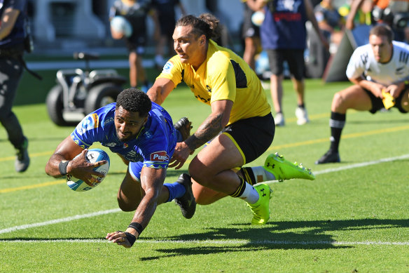 Junior Ratuva of the Fijian Drua scores a try against the Hurricanes.