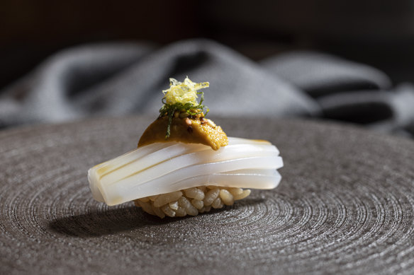 Calamari nigiri topped with sea urchin.