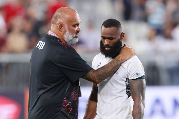 Simon Raiwalui consoling Semi Radradra after dropping a ball that could have given Fiji the win against Wales.