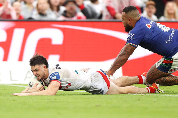 Dragons fullback Cody Ramsey dives over for a try against the Warriors.