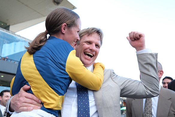 Jockey Rachel King and trainer Bjorn Baker celebrate.