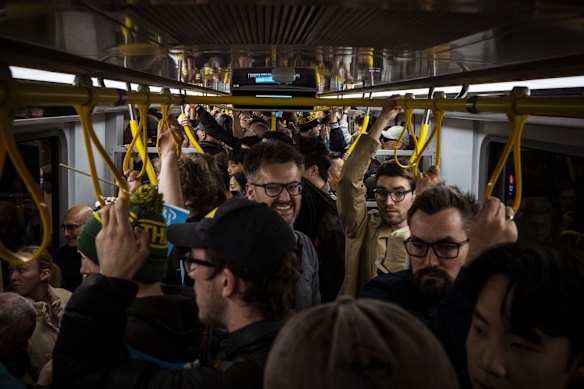 Passengers on the first train to go through the Metro Tunnel.