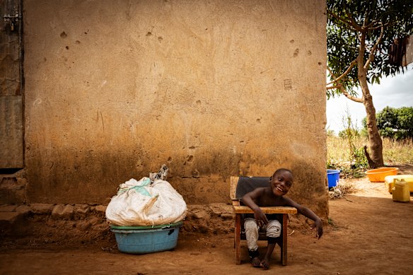 Three-year-old Felix sits upright in his CP (cerebral palsy) chair. Such assistive devices are rare in Uganda but can provide the child with a certain amount of independence, meaning the parent can work or do chores. 