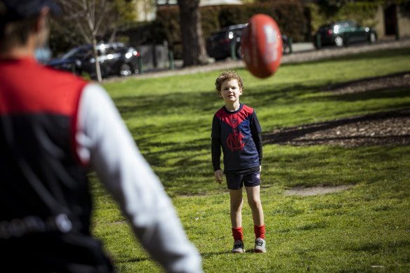 James Dowling and his son Cooper have a kick at the ’G on Sunday.