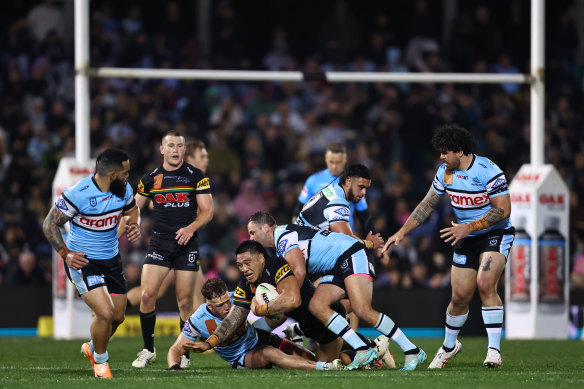 Cameron McInnes makes one of his 84 tackles against the premiers.