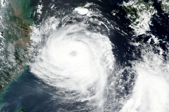 Satellite image released by NASA shows Typhoon Bavi near South Korean island of Jeju on Tuesday.