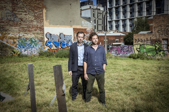 Former law students Duncan Wallace and Tim Staindl at the site of the Melbourne law school favourite, the Corkman Irish pub, which was illegally knocked down in 2016.