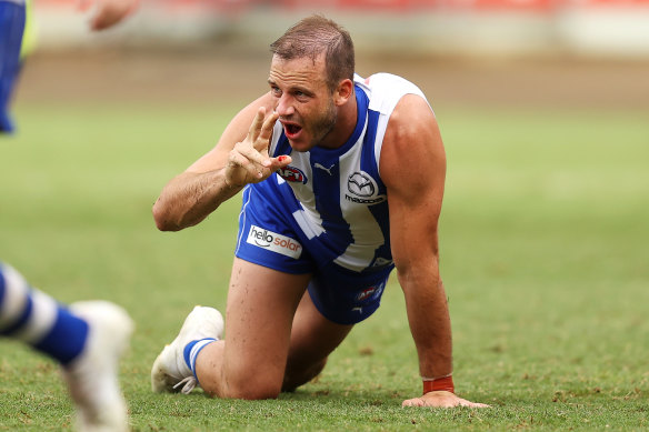 Josh Walker calls from the trainer as blood drips from his mouth. 