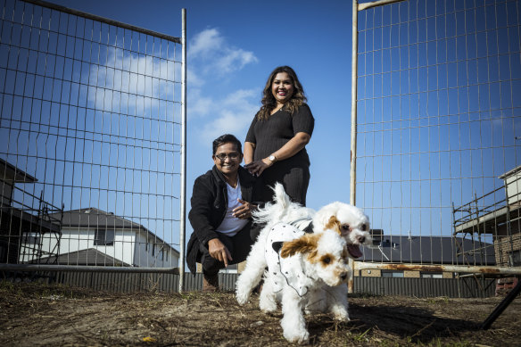 Gelora Alphonse and Sharaniah Thasarathan with their dogs, Yuki and Yuna, on their block of land in Clyde. 