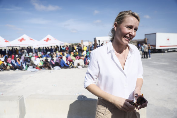 Vice president of the French party  Reconquete Marion Marechal Le Pen talks to journalists as migrants wait to be transferred from Lampedusa to the mainland.