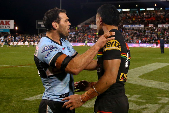 Dale Finucane looks at the ear of Stephen Crichton.