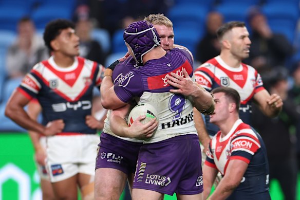 Josh King celebrates scoring a try with Harry Grant.
