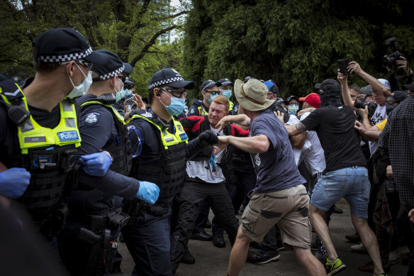 Protesters scuffle with police at the Shrine of Remembrance.