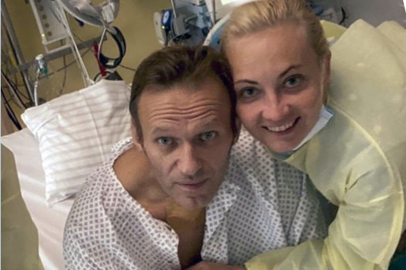 Alexei Navalny, pictured with his wife Yulia, is recovering in a German hospital.
