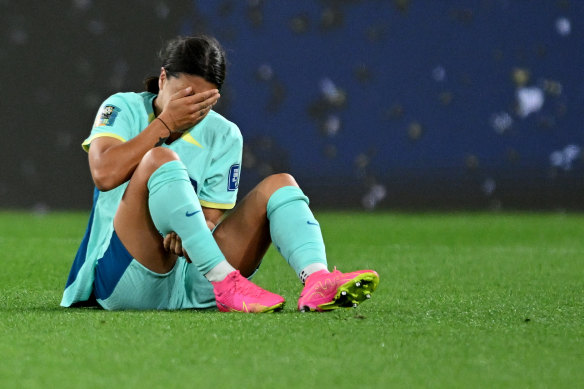 Sam Kerr on the ground after copping contact in the back of her calf.