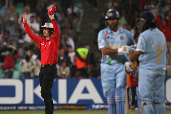 On repeat: Umpire Simon Taufel signals a six during Yuvraj Singh’s blitz.