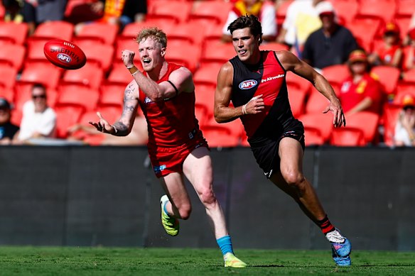 John Noble disposes of the ball in Saturday’s game.