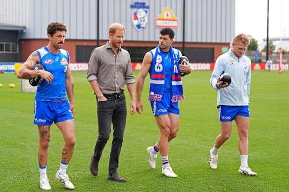The Duke of Sussex meets, from left, Tom Liberatore, Matthew Kennedy and Adam Treloar.