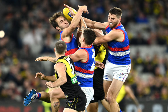 Bulldogs midfielder Rhylee West (left) goes back with the flight of the ball against Richmond.