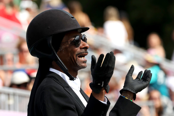 Snoop Dogg attends the dressage team grand prix special at Versailles on day eight of the Olympic Games.