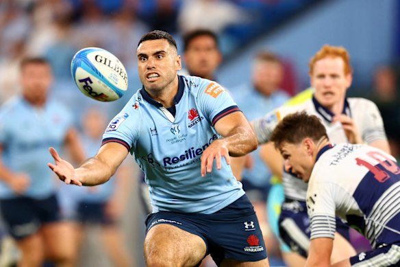 Jack Debreczeni of the Waratahs juggles the ball.