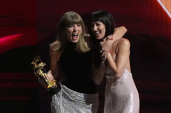 Dakota Johnson (right) presented the Artist Director Honours to Taylor Swift (left) before the Patient Zero music video premiered.
