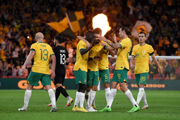 Awer Mabil celebrates his long-range winner with Socceroos teammates.