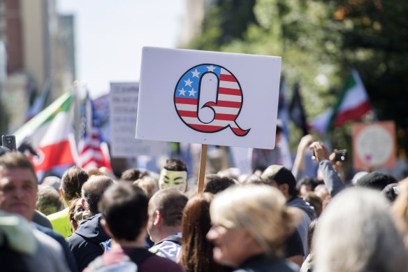 A "Q" sign at an anti-mask protest in Montreal, Canada. 