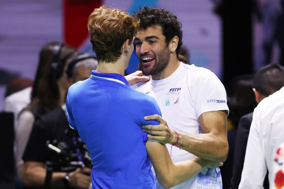 Italian teammates Jannik Sinner and Matteo Berrettini celebrate their semi-final win.