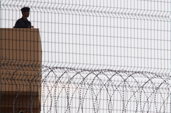 A guard keeps watch over Changi Prison.