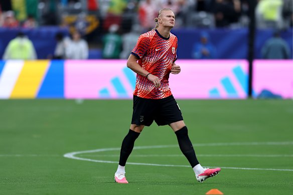 Haaland warms up ahead of the match against Senegal.