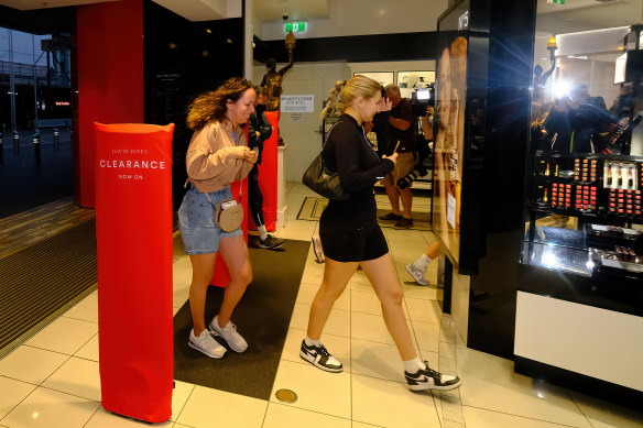 Sisters Olivia and Chloe Bettane hunt for bargains at David Jones on Boxing Day.