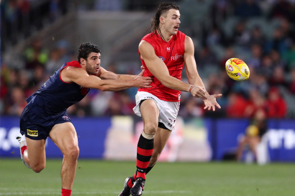 Sam Draper of the Bombers and Christian Petracca of the Demons during round five.