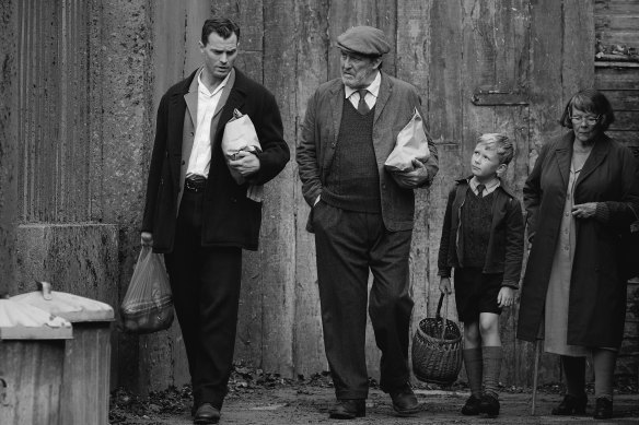 Pa (Jamie Dornan, from left) with Pop (Ciaran Hinds), Buddy (Jude Hill)  and Granny (Judi Dench).